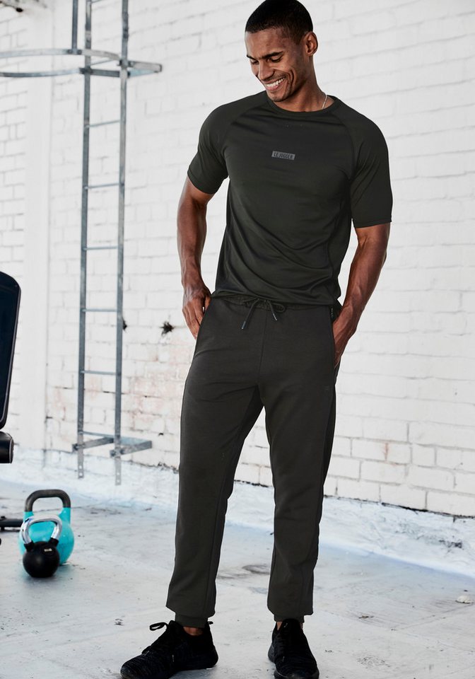 le jogger® Sweatpants mit farblichen Einsatz und Reißverschlusstaschen – Bild 3 von 5